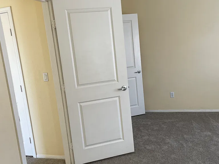 2nd bedroom-3rd floor entrance and closet in the back left corner