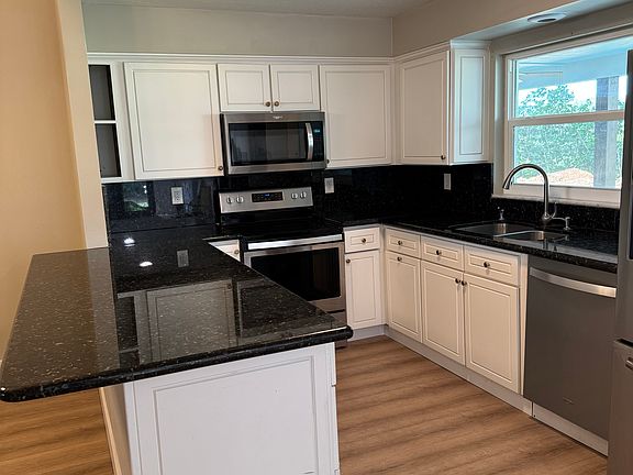 Granite counters and wood cabinets