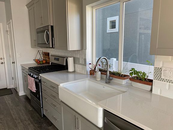 Gorgeous backsplash and farm sink.