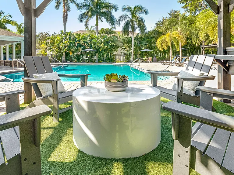 Relax on the spacious sundeck with free poolside Wi-Fi - a stylish space for residents to unwind and stay connected.