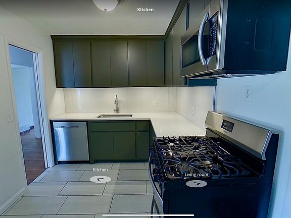 Renovated Kitchen with stainless appliances including refridgerator.