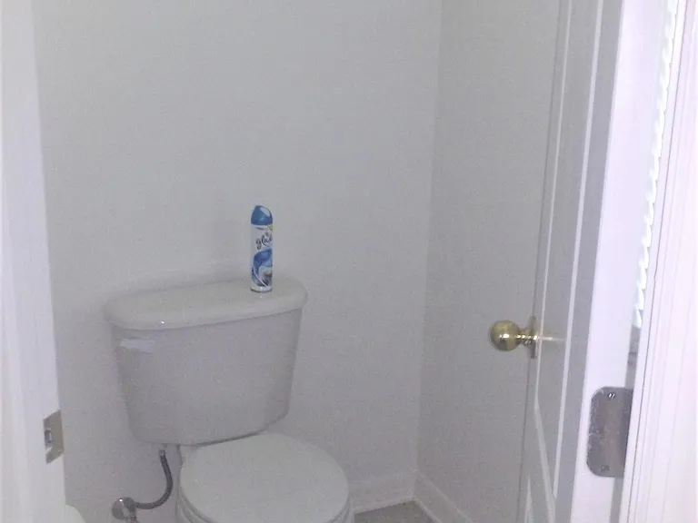 Master Bathroom private privy, with full size window behind door.