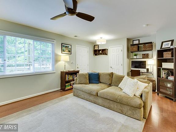 Living Room w/  built-in elfa shelving and desk