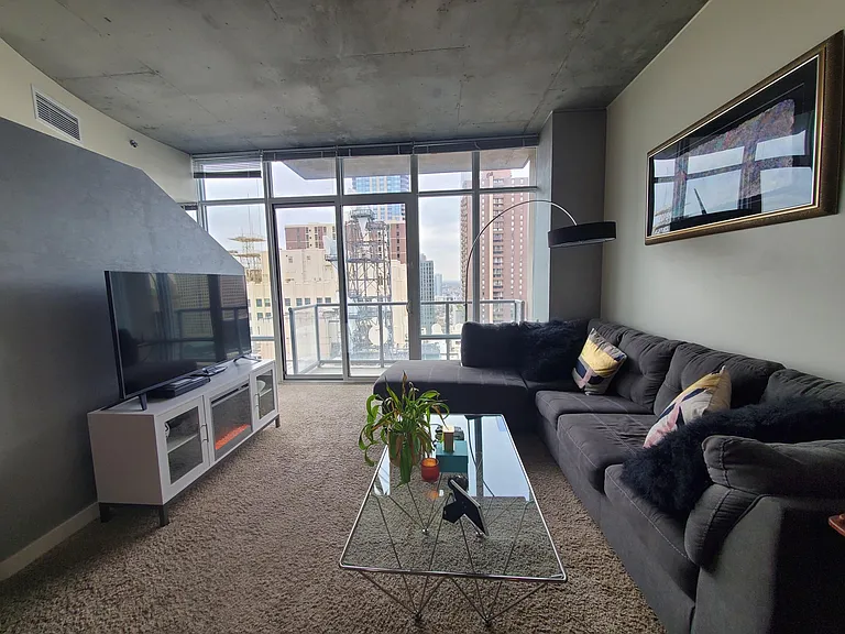 Large comfy couch (convertible bed) & Roku TV with DIRECTV included + streaming apps