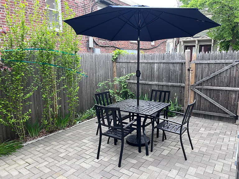 Patio, shared by all 3 units in building.