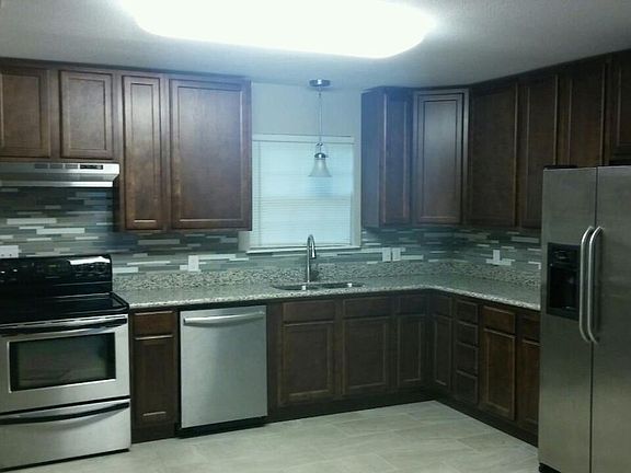 Designer Kitchen with Stainless Steel Appliances and Granite