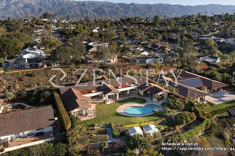 Single-story estate with classic tile roof and expansive frontage