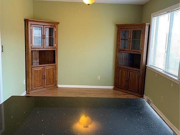 Eating space features 2 cabinets for more storage.