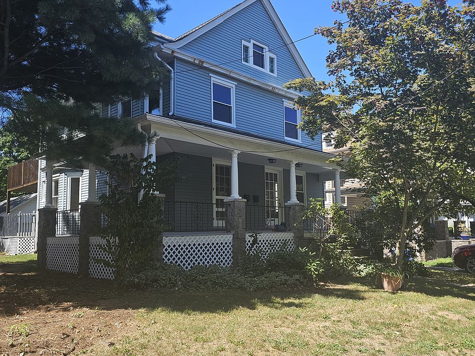 Front of house with wrap-around porch