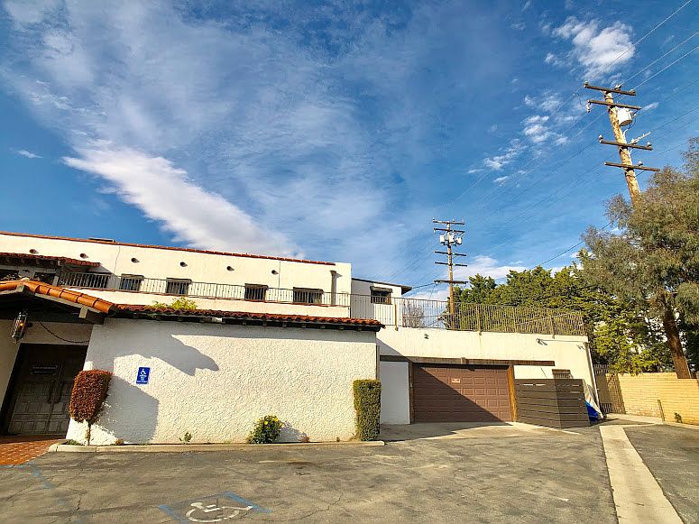 Building; upstairs balcony and windows are available unit.