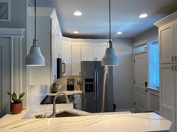 Back entrance off kitchen, directly to secured gated parking spot.