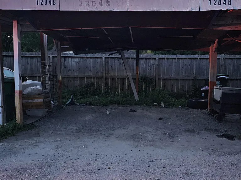 Detached parking space, directly across back entrance