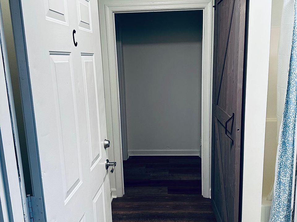 Entrance to the apartment with full bath and great barn door