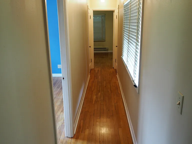 Hallway looking towards master bedroom, second bedroom on the left.
