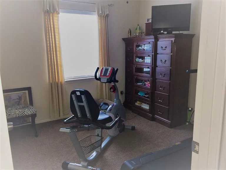 Bedroom #3 currently used as Gym. Walker, Bike and rowing ma