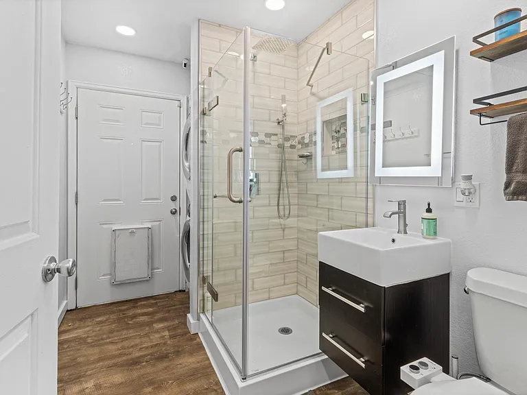 Second bathroom + Laundry room with dog door