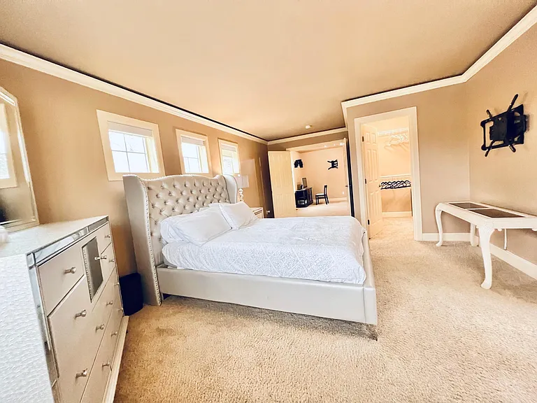 Master bedroom view into entrance and walk-in closet