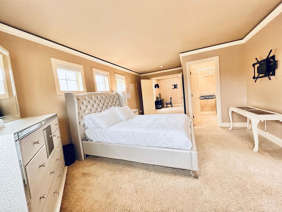 Master bedroom view into entrance and walk-in closet
