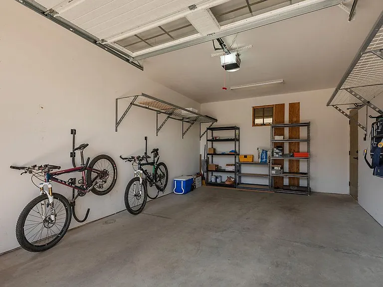 Garage space with auto door, storage (bikes not included in lease)