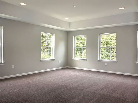 Master bedroom with tray ceiling. Pictured is original Gemini model - quick delivery may differ.