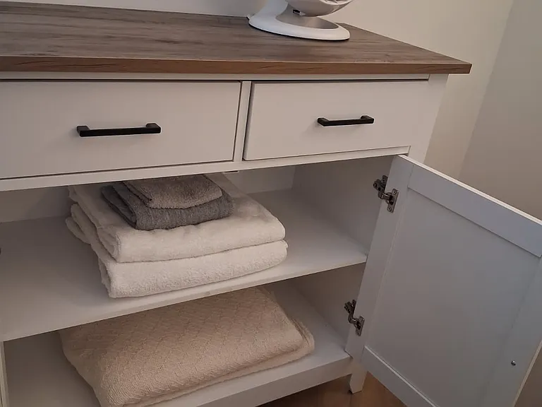 storage cabinet in BR with extra linens