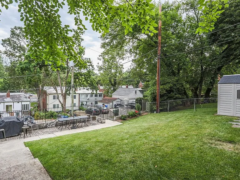 Back yard with grill patio and storage shed