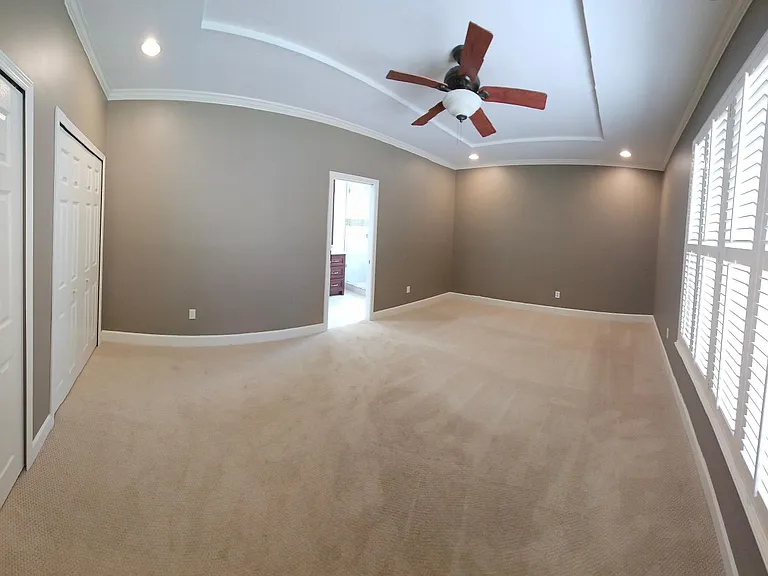 Dual master closets and entrance to master bathroom.