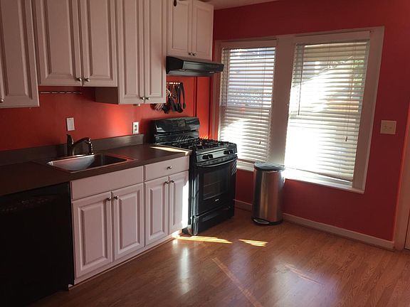 Large kitchen with lots of natural light, ceiling fan, moder
