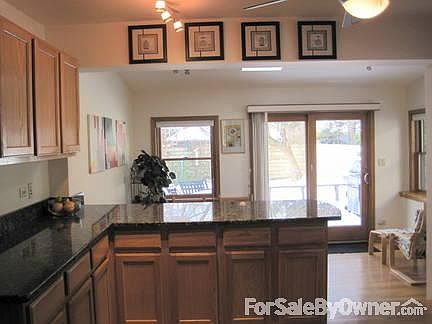 Kitchen 1
						:
						Walk out to deck. Skylight in dining area.