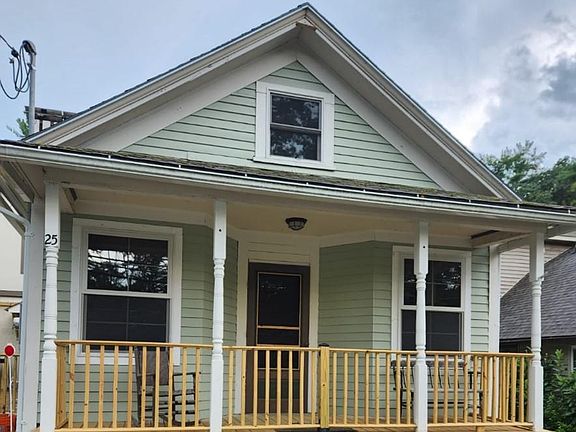 Note the closed-in porch and the flower boxes.
