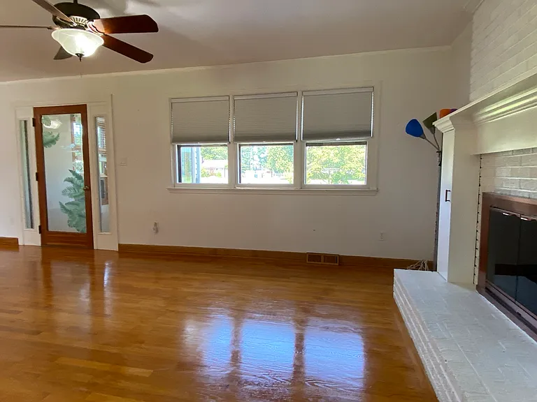 Living Room w/ Clg Fan & Vestibule to Outside