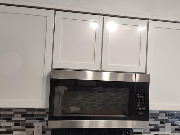Custom kitchen cabinets and microwave