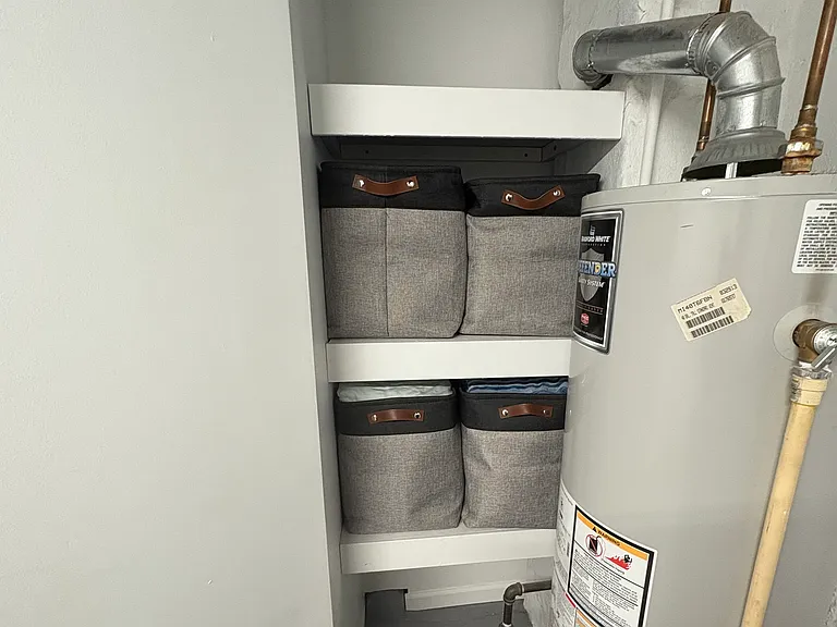 Laundry room and half bathroom built in storage shelves