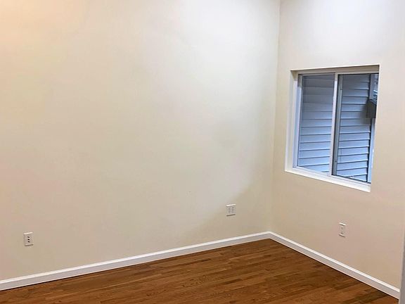 bedroom off living room . spacious room, large closet, high ceiling