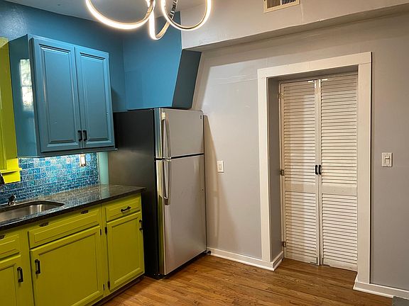 Right View of Kitchen with Bedroom Doors