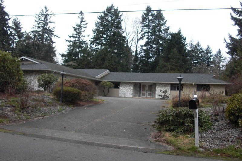 Front of home with three car garage