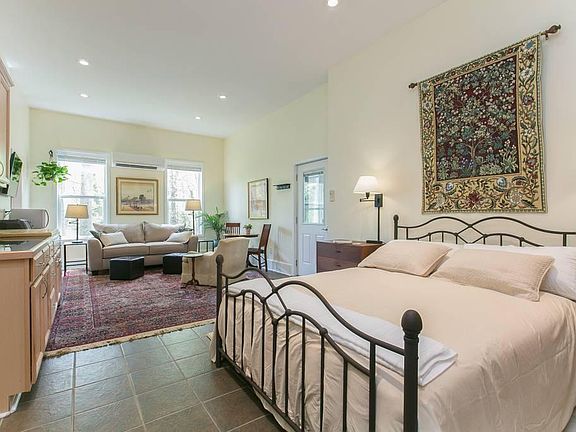 Queen size bed, kitchenette, sleep-out sofa, dinette table/work space.