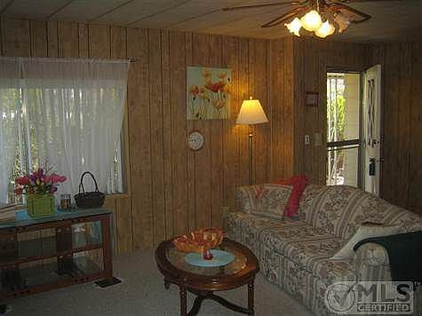 View from dining area of entry and partial living room.