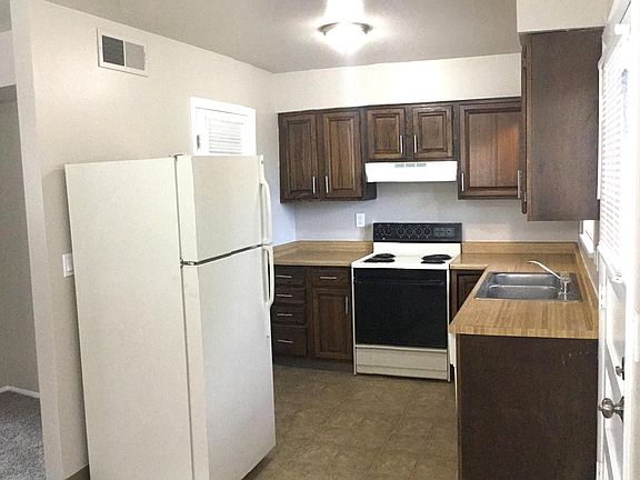 Kitchen with refrigerator/freezer, stove and dishwasher