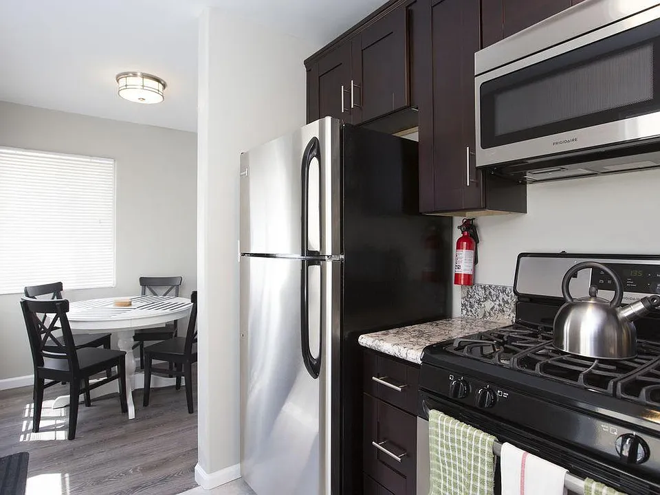 Our Granite top kitchen with stove, oven, and stainless stee