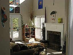 Bright, open spaces with view of spacious back yard.