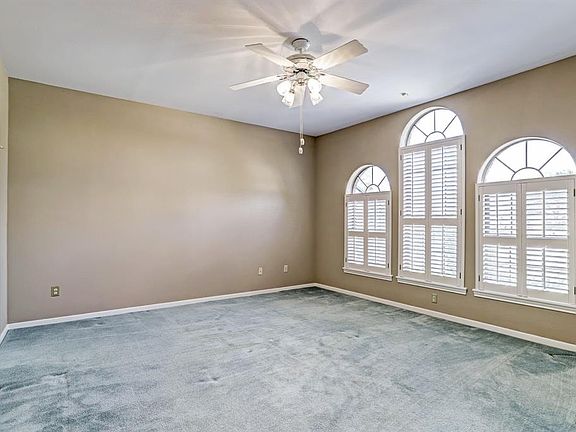 1st Bedroom w/ Walk-in Closet and En Suite Bath.