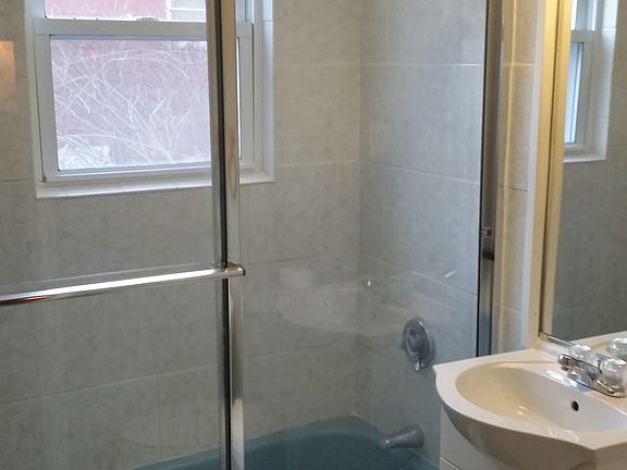 glass shower door, new vanity, tile