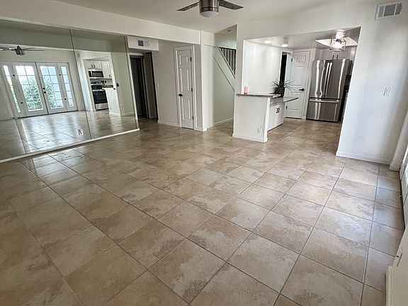 Large living area with doors to private patio