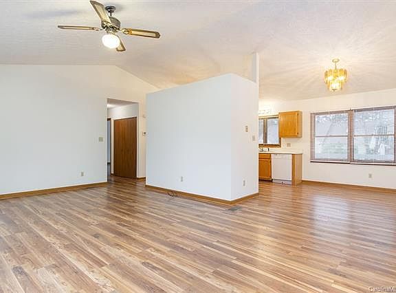 Living room, dining room and kitchen around the corner