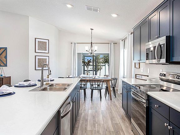 Dine at the island, or in the sunny cafe - Parker by Highland Homes