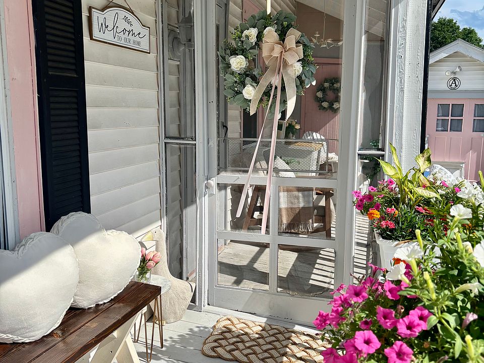 Welcome to your screened-in porch. Escape the summer heat as you enjoy a fresh lemonade while sitting in a rocking chair.