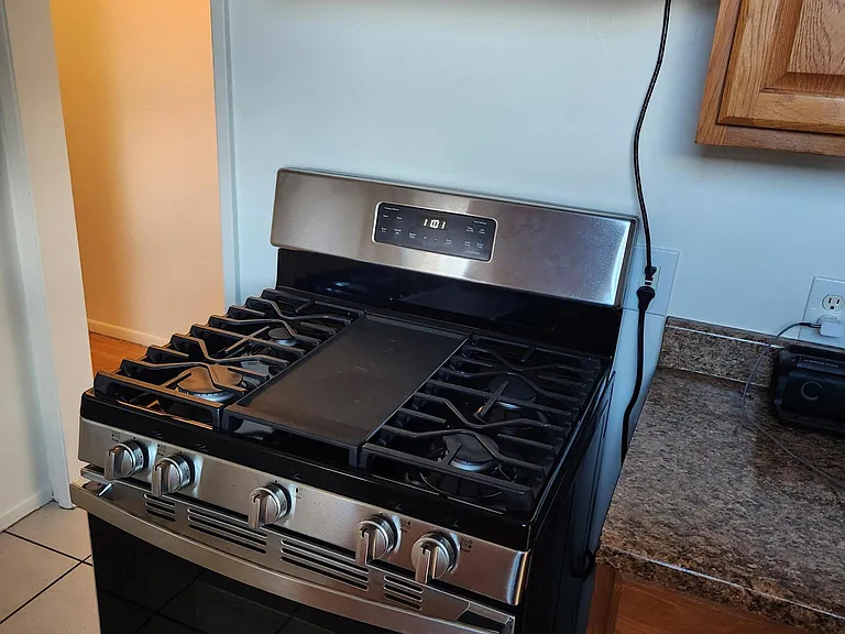 Brand new stainless steel gas range and exhaust