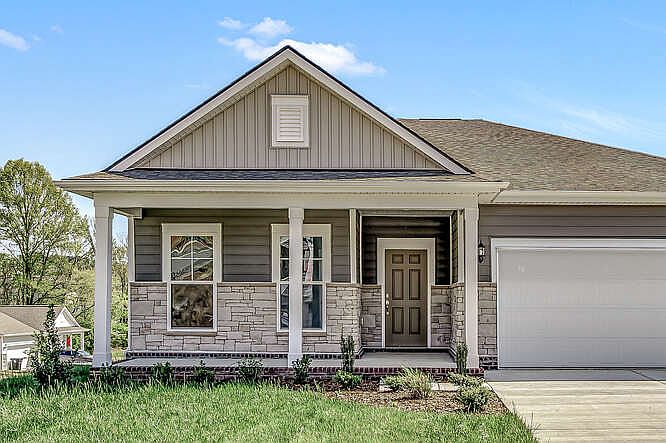 Beautiful front porch with small lawn.