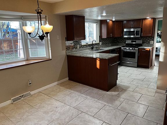 Kitchen with eating area overlooking the backyard